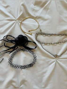 Bundle of choker necklaces and arm bangle